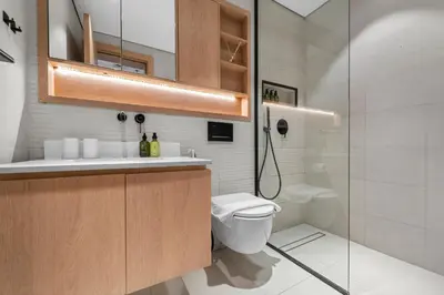 a bathroom with a toilet and a shower at VayK - Contemporary and Cozy Studio in the Heart of JVC in Dubai