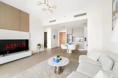 a living room with a couch and a table at VayK - Stunning 1BR with Breathtaking Views in Dubai