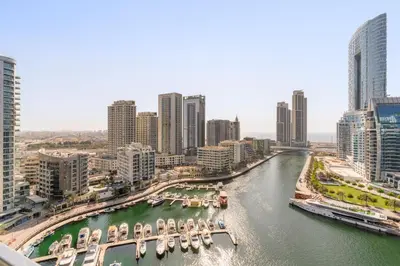 a view of a river in a city with buildings at VayK - Ocean View 1BR in the Heart of Dubai Marina in Dubai