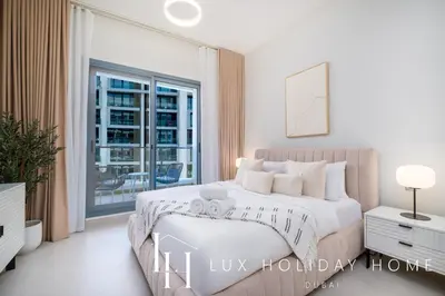 a white bedroom with a bed and a window at LUX Dubai Hills Sway Studio 2 in Dubai