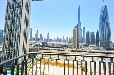 a view of a city skyline from a balcony at DTV 2BR Burj View, Pool in Dubai