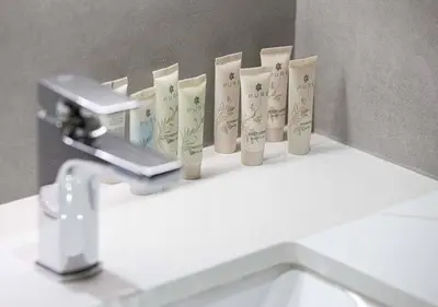 a row of toothbrushes sitting on top of a sink at Waterfront 1BR - Canal View - Fully Furnished in Dubai