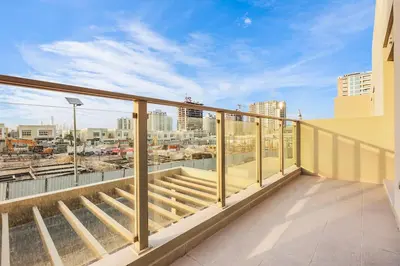 a balcony with a view of a city at Stylish 4BR Family Villa Easy Access to Dubai Marina & Expo City in Dubai