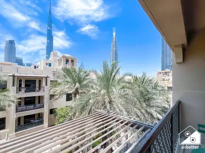 a view of the city from the balcony of a building at Burj Views from Balcony l Chic 2BR in Downtown in Dubai