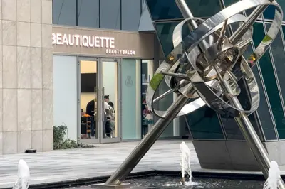 a metal sculpture in front of a building at Modern Living with Canal Views, Near Burj Khalifa and World Trade Center in Dubai