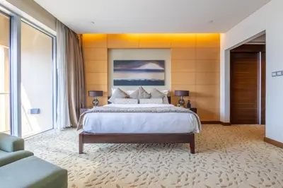 a bedroom with a large bed and a large window at SuperHost EMAAR Residences Fashion Avenue - Former Address Dubai Mall Studio's & 1 BR in Dubai