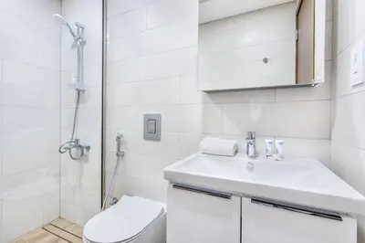 a bathroom with a toilet and a sink and a shower at VacayLettings - 1 BHK - Near Jebel Ali Port- IKEA - Metro 20 Min - Al Furjan in Dubai