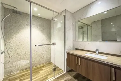 a bathroom with a sink and a shower at Experience Modern Comforts Near Iconic Dubai Mall and Burj Khalifa in Dubai