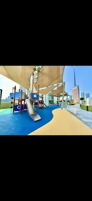 a playground with a slide at a playground at Downtown Views 2 - Burj Khalifa View in Dubai