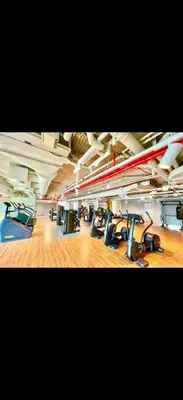 a gym with lots of empty chairs in a room at Downtown Views 2 - Burj Khalifa View in Dubai