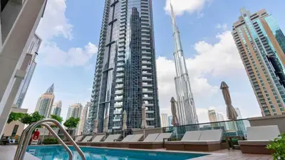 a swimming pool with a view of a city at TRPS - Act One Act Two Towers, Downtown Dubai, Iconic 3BR plus Maids - with Burj Khalifa Views - Near Dubai Mall in Dubai