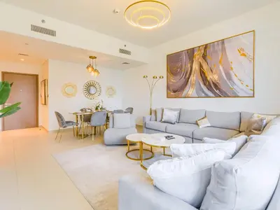 a living room with a couch and a table at TRPS - Act One Act Two Towers, Downtown Dubai, Iconic 3BR plus Maids - with Burj Khalifa Views - Near Dubai Mall in Dubai