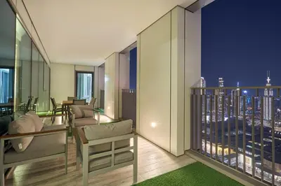 a room with a view of a city skyline at Luxury 4 Bedroom High-Floor Apartment, Spectacular Burj Khalifa & Fountain Views, Steps Away from Dubai Mall - Downtown Dubai by Stayfinity in Dubai