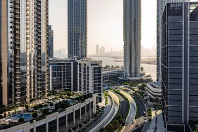 a view of a city with tall buildings and a highway at Alluring 1BDR apartment in Dubai Creek Harbour in Dubai