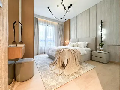 a bedroom with a bed with a blanket on it at Chic 1BR on La Mer Upgraded & Elegant in Dubai