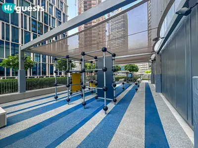 a gym in the middle of a building at HiGuests - Wake up to Burj Khalifa views in stunning 2 BR in Dubai