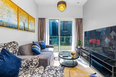 a living room with a couch and a piano at Business Bay 2 Bedroom with Burj Khalifa Views in Dubai