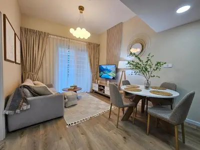 a living room with a table and a couch at Luxury 1BR by dubai marina walk! in Dubai