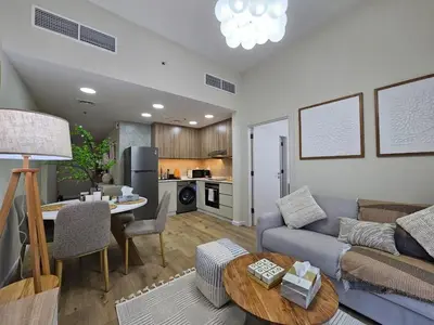a living room with a couch and a table at Luxury 1BR by dubai marina walk! in Dubai