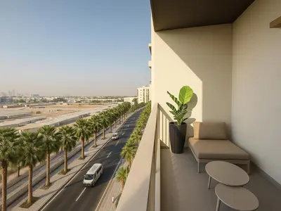a balcony with a view of a road and palm trees at Modern Studio in Meydan - Minutes from Dubai Mall in Dubai