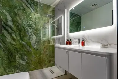 a bathroom with a sink and a shower at Marina Wharf 1 Bedroom with JBR Beach Views in Dubai