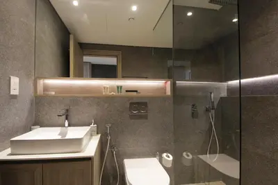 a bathroom with a sink and a shower at Contemporary JVC Studio with Rooftop Pool Gym in Dubai