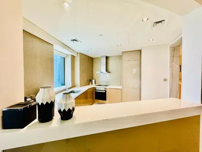 two vases sitting on a counter in a kitchen at Luxe 3BR , Paramount by DAMAC, Excellent Pool in Dubai
