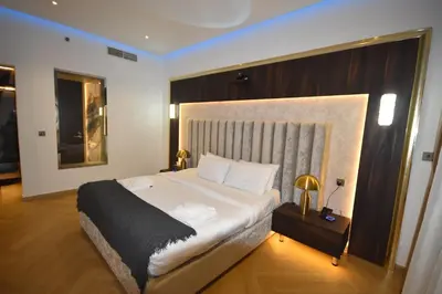 a bedroom with a large bed in a room at Highend Azure 1BR Sea View and Private Beach with Pool Access in Dubai