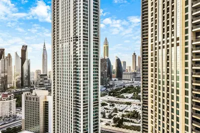 a view of a large city with tall buildings at FIRST CLASS 1BR Stylish Gem Near Dubai Mall in Dubai