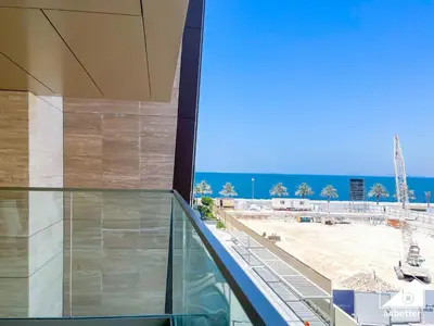 an office building with a view of a construction site at Seafront Serenity Palm Escape with Pool Access in Dubai