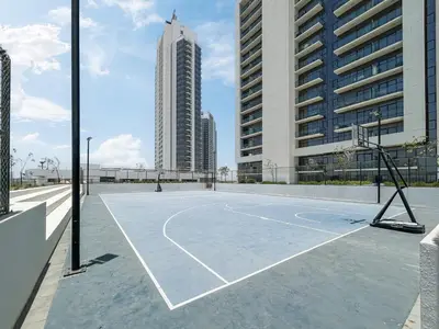 an empty basketball court in the middle of a city at Contemporary 1BR Home in Damac Hills in Dubai