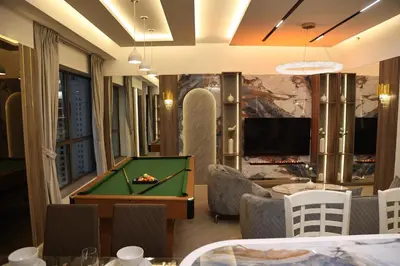 a room with a pool table and a tv at Highend 2BR Sea and Beach View in Dubai