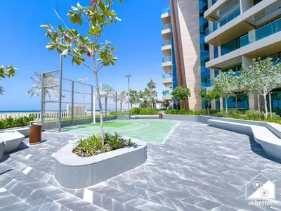 a basketball court in the courtyard of a building at Luxury Beachfront 1BR on Palm Jumeirah & Balcony in Dubai
