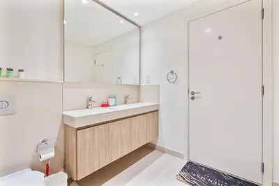 a bathroom with a sink and a shower at 3BR APT with Burj View from Balcony - Pool and Gym in Dubai
