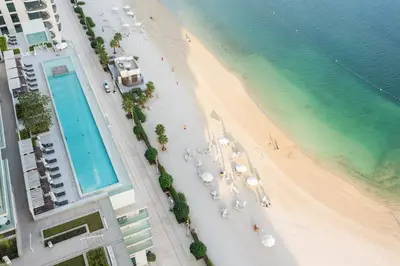 an overhead view of a beach and the ocean at 4BR Beachfront Marina & Palm View in Dubai