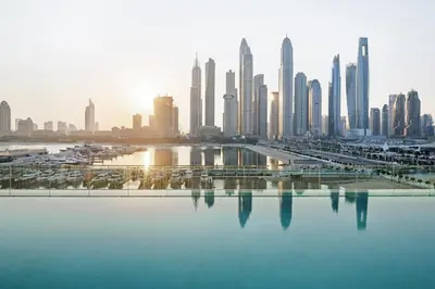 a view of a large city with a large body of water at 4BR Beachfront Marina & Palm View in Dubai