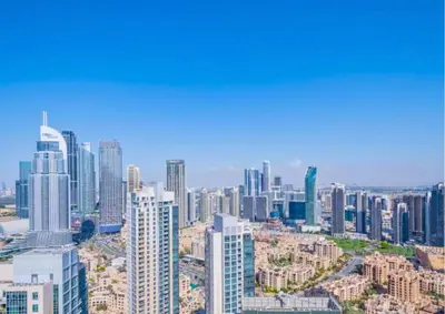 an aerial view of a large city with tall buildings at Exceptional 1BR I Burj Khalifa I Fountain View in Dubai