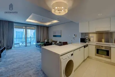 a large kitchen and living room with a living room at Exclusive 1BDR Near Burj Khalifa with Free Parking in Dubai