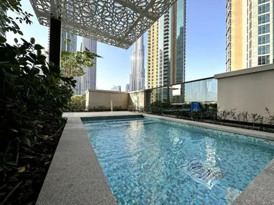 a swimming pool on top of a building with tall buildings at Downtown Escape 2bedroom Apartment 4 guests Dubai in Dubai