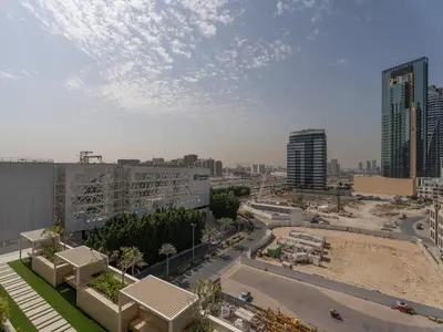 a view of a city with tall buildings and a street at Luxe Escape - Stylish 1BR in Binghatti Venus-05 in Dubai