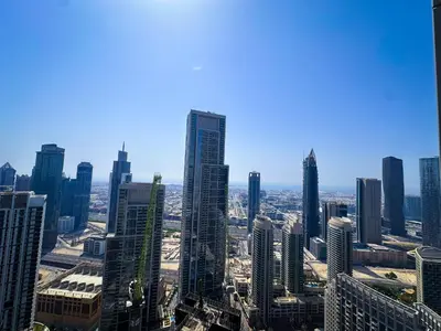 an aerial view of a city with tall buildings at Grande Signature Burj Khalifa view 4 Min walk Dubai Mall Infinity Pool with Fountain View Free parking By The Meridian in Dubai