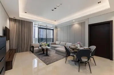 a living room with a couch and a table at Nobles Tower tiger one skyline view in Dubai