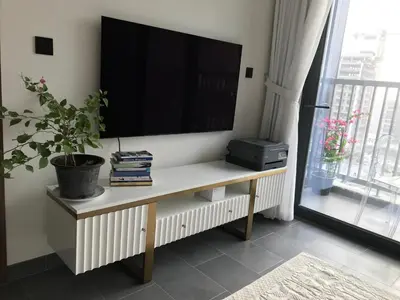 a living room with a tv on the wall at Dubai dream in Dubai