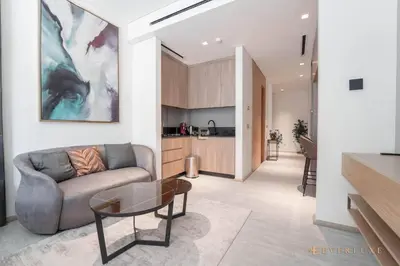 a living room with a couch and a table at Contemporary Studio Terrace Luxe & Secure Stay in Dubai