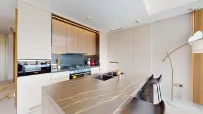 a kitchen with a counter with a sink in it at Jumeirah Golf Estate - Elegant Three Bed Villa in Dubai