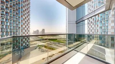a glass balcony in a building with a view of a city at Vacationer I Vista 2 Bedroom I Business Bay I Free Parking, Pool, Gym & Wi-Fi in Dubai