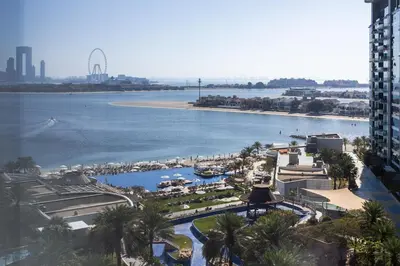 an aerial view of a resort with a river and a beach at 4BR Oceana Residences - Beach and Pool Access in Dubai