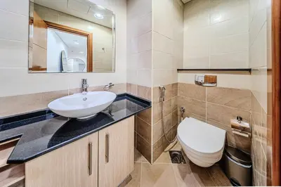a bathroom with a sink and a toilet at 1BD in Ocean Heights, Dubai Marina for 4 Guests in Dubai