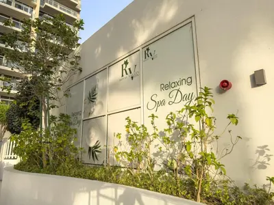 a building with plants on the side of it at Garden Hideaway 2BR Boho Duplex Resort Living in Dubai