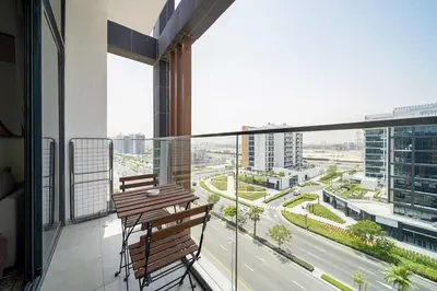 a balcony with a bench and a view of a city at PVH - Stylish 1BR Near Dubai Mall - Azizi Riviera in Dubai